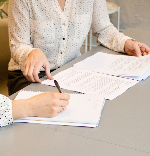 People working with papers on desk